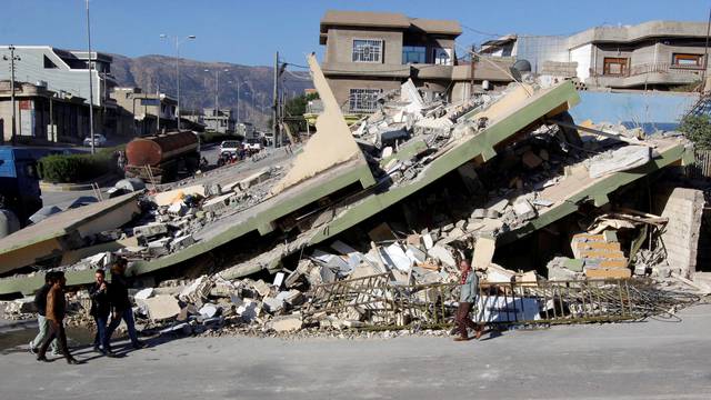 Collapsed building is seen in the town of Darbandikhan