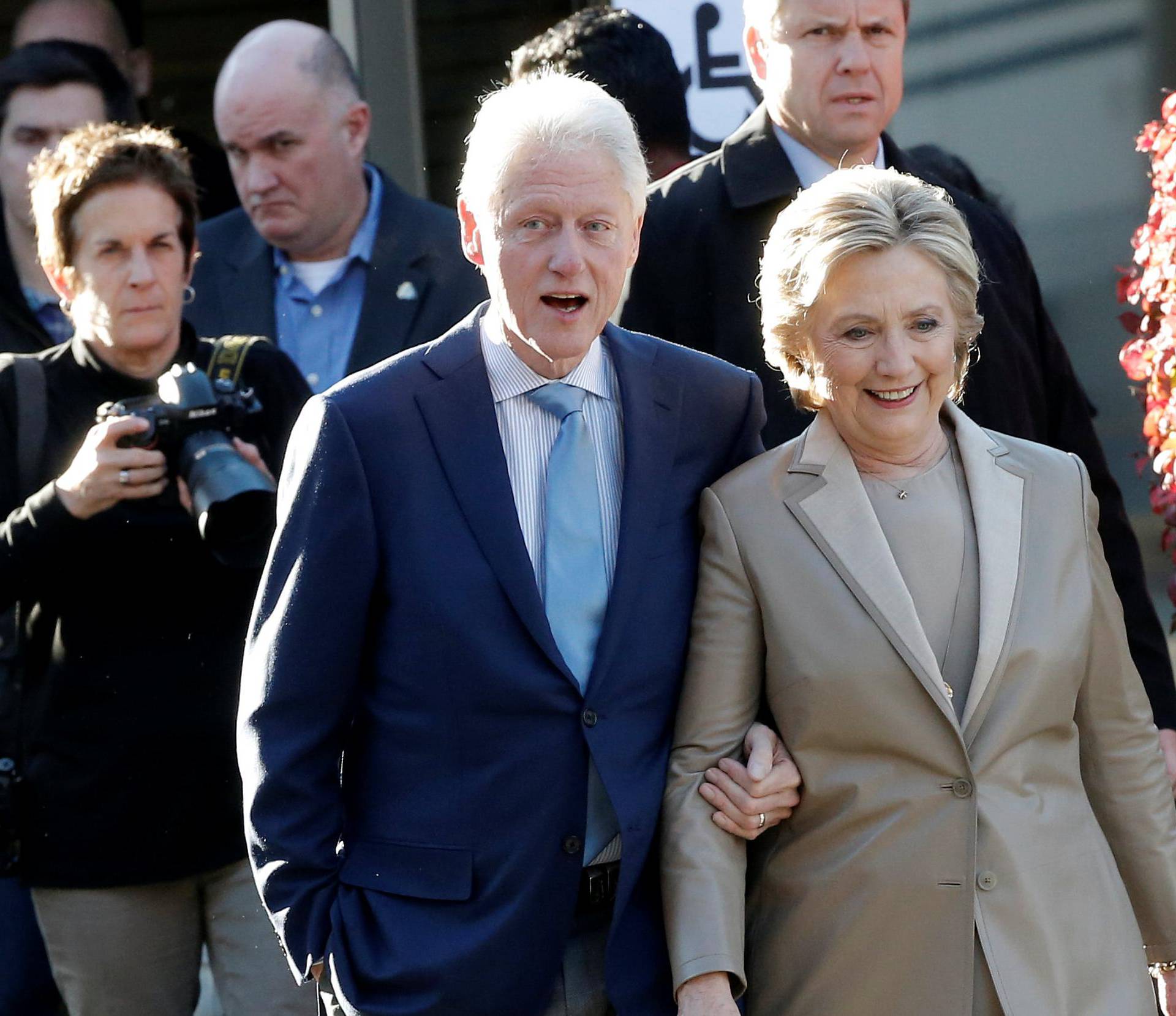 Democratic U.S. presidential nominee Hillary Clinton and her husband former U.S. president Bill Clinton depart after voting in the U.S. presidential election at the Grafflin Elementary School in Chappaqua