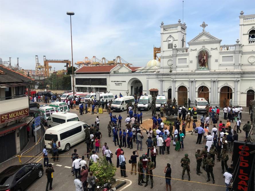 Sri Lankan military officials stand guard in front of the St. Anthony's Shrine, Kochchikade church after an explosion in Colombo