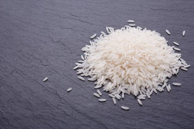 Jasmine rice on a dark stone background
