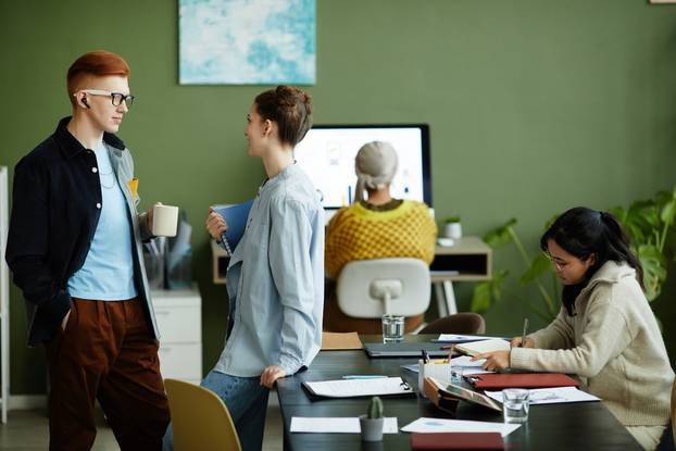 Diverse,Group,Of,Creative,Young,People,Working,In,Vibrant,Green