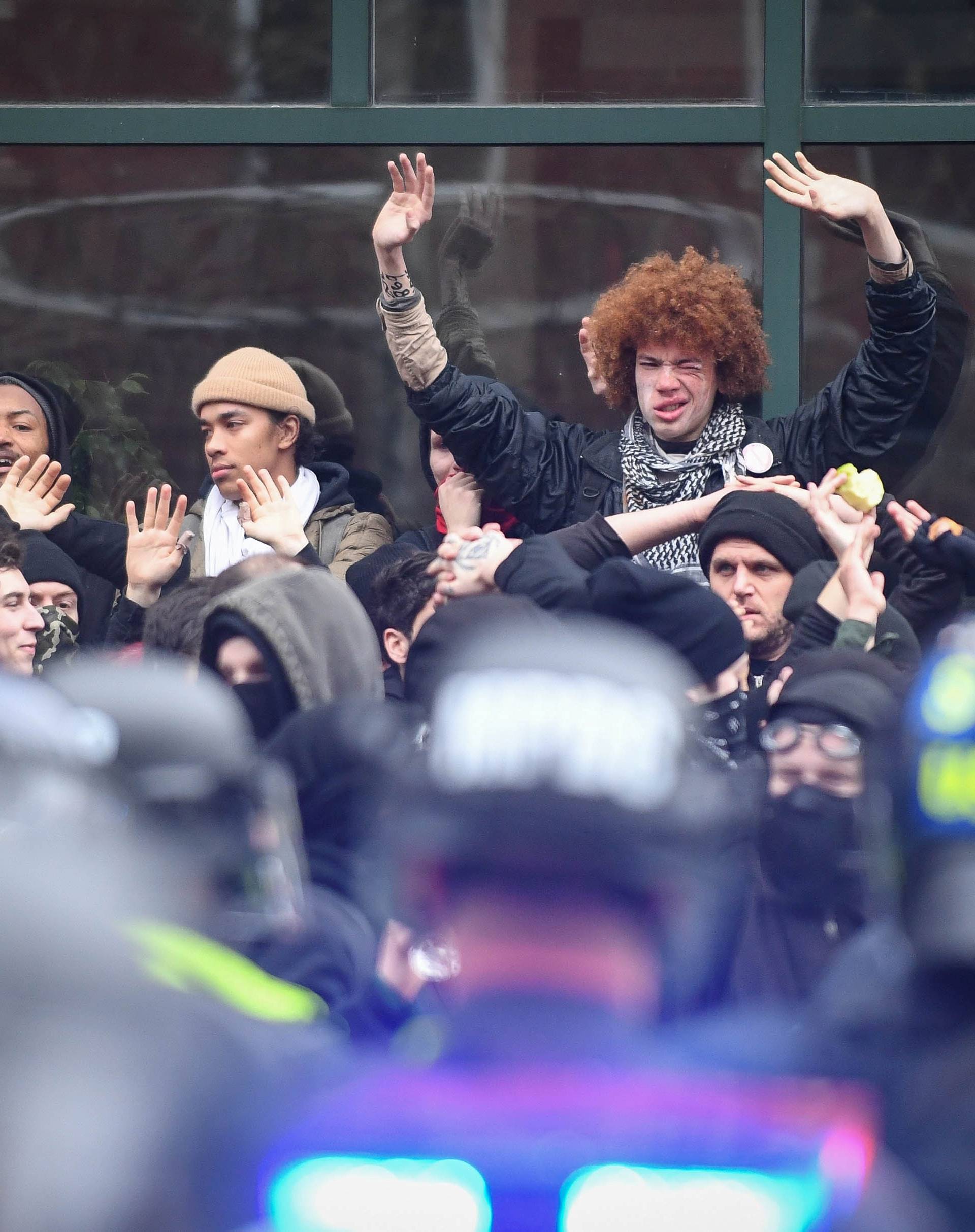 Protesters are surrounded by police during protest near the inauguration of President-elect Donald Trump in Washington