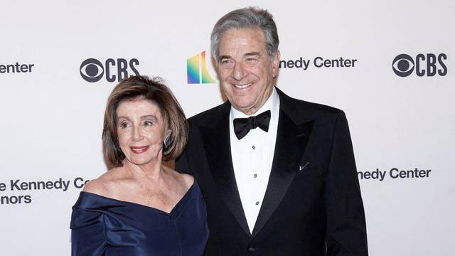 FILE PHOTO: Speaker of the House Nancy Pelosi (D-CA) and her husband Paul Pelosi arrive for the 42nd Annual Kennedy Awards Honors in Washington