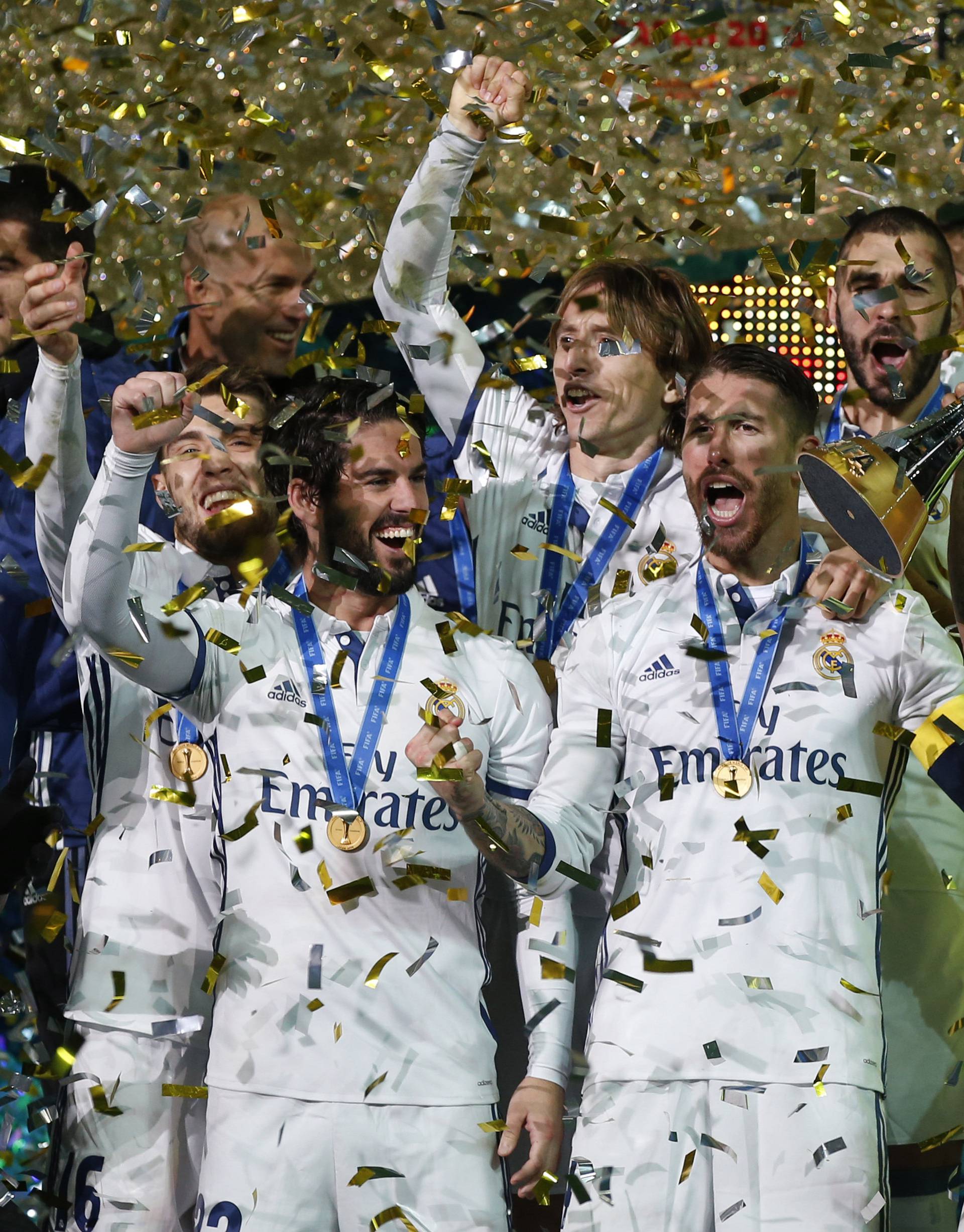 Real Madrid's Sergio Ramos and team mates celebrate winning the FIFA Club World Cup Final with the trophy