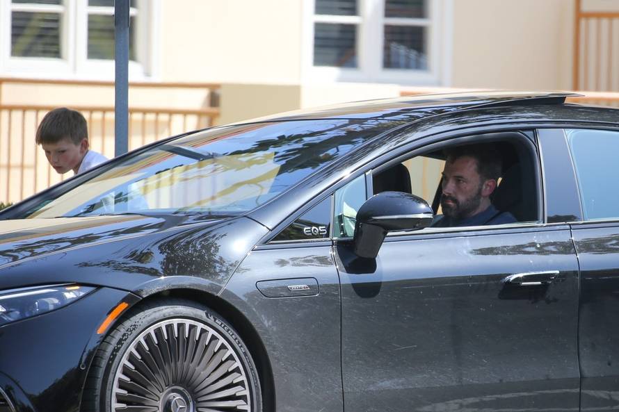 *EXCLUSIVE* Ben Affleck looks busy while driving as he picks up his son Samuel in Santa Monica