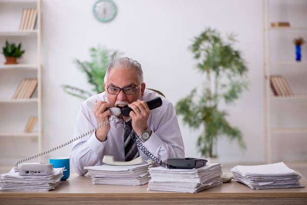 Old,Male,Employee,And,Too,Much,Work,In,The,Office