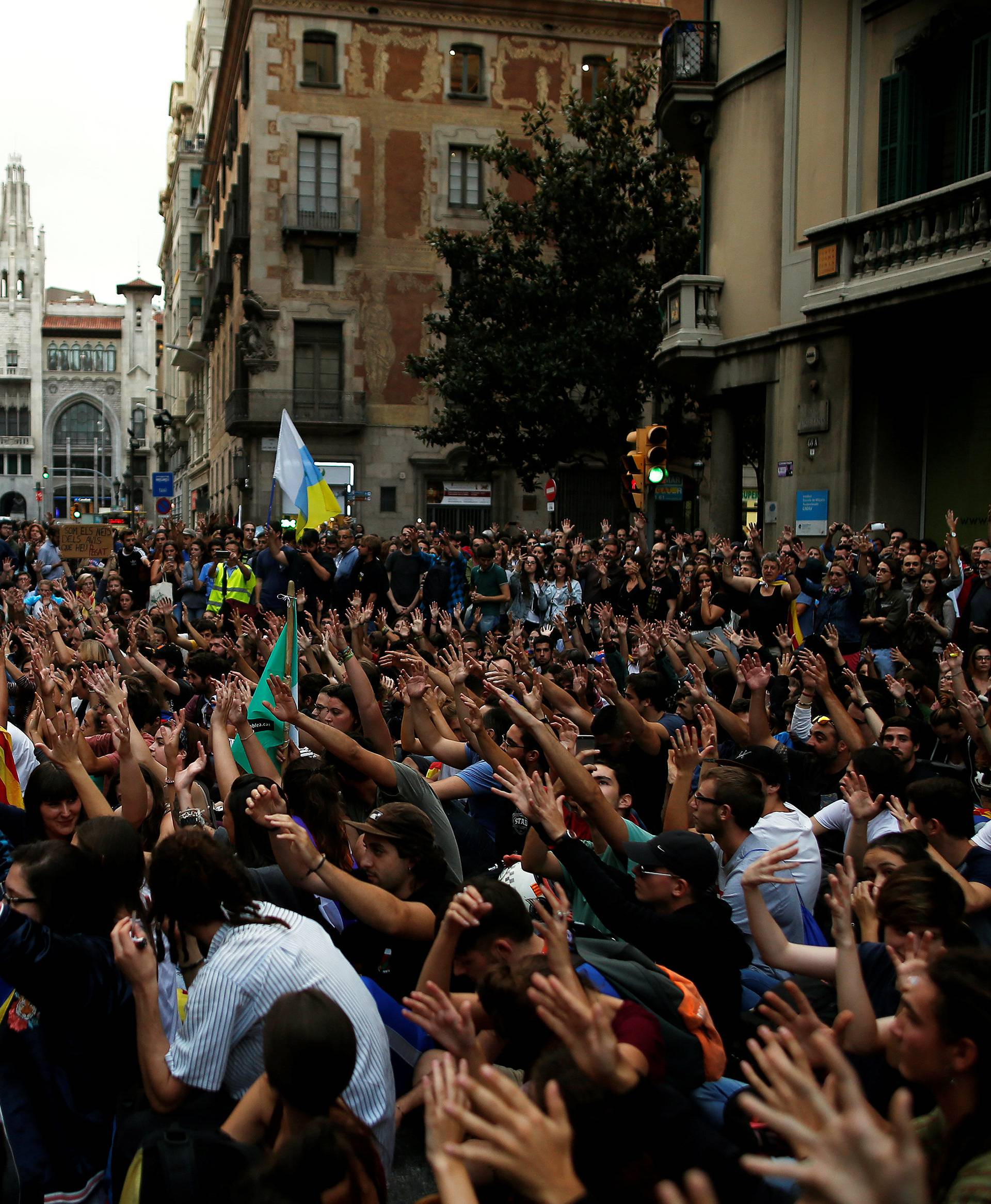 Demonstrators gather during a protest against Spanish National Police officers in Barcelona