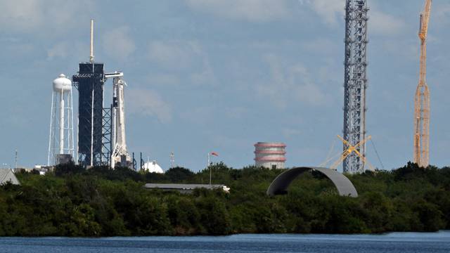 FILE PHOTO: A SpaceX Falcon 9 rocket with the Crew Dragon capsule stands on Pad-39A in preparation for a mission to carry four crew members to the International Space Station