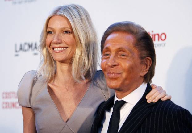 FILE PHOTO: Actress Paltrow and fashion designer Garavani pose at the West Coast premiere of 