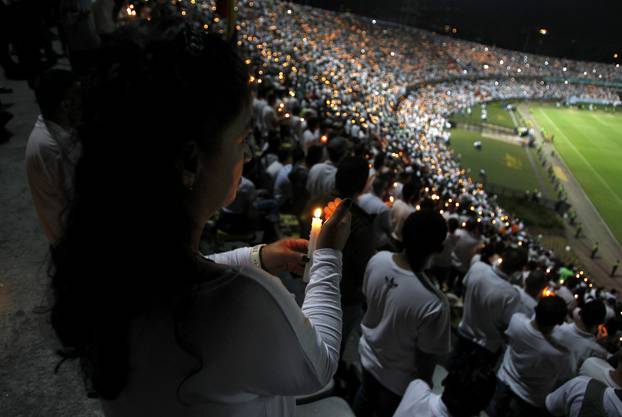 Fans of Atletico Nacional soccer club pay tribute to the players of Brazilian club Chapecoense killed in the recent airplane crash in Medellin