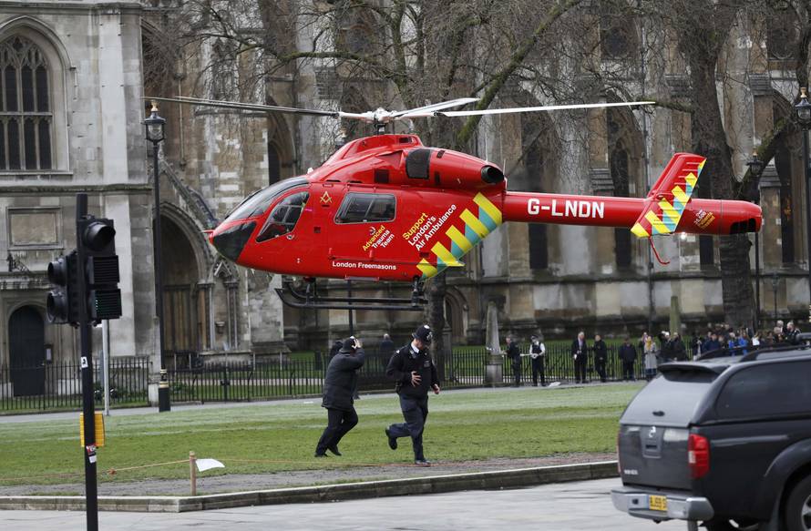 An air ambulance lands in Parliament Square during an incident on Westminster Bridge in London