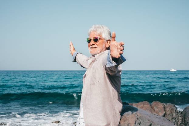 Vacation,Retirement,Lifestyle,Concept,At,Sea,,Happy,Senior,Man,With