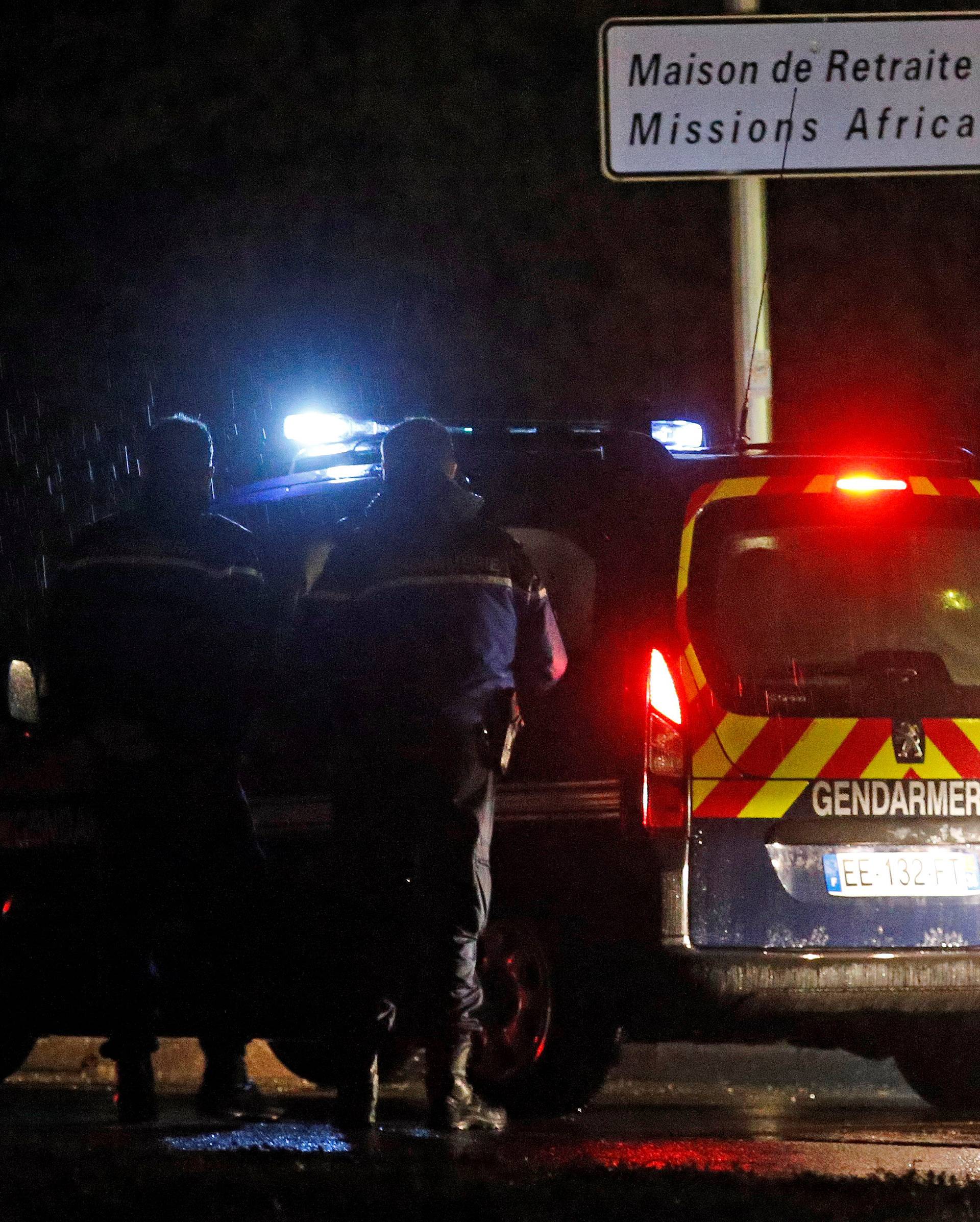 French gendarmes stand guard near a retirement home in Montferrier-sur-Lez, near Montpellier