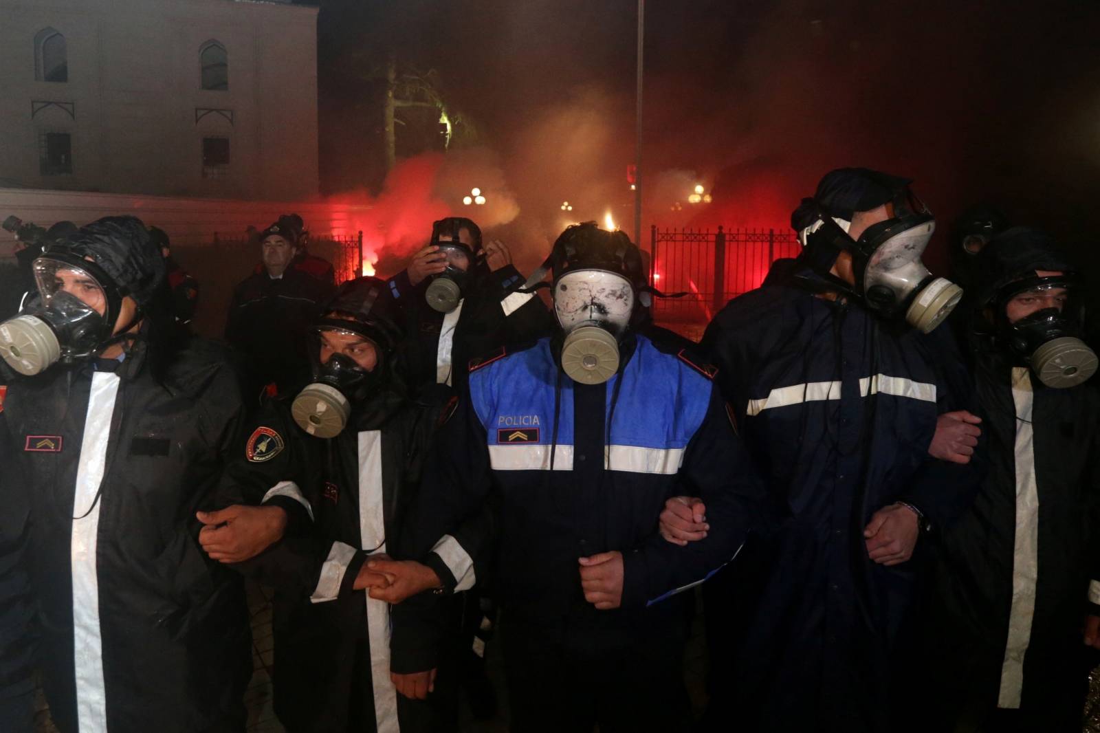 Police officers are seen during an anti-government protest in front of the Parliament Building in Tirana