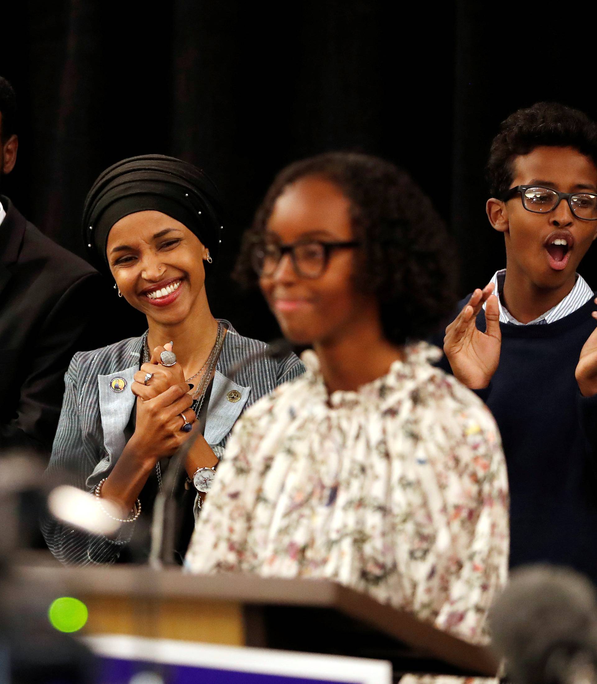 Democratic congressional candidate Ilhan Omar  listens as she is introduced by her daughter, Isra at her election night party in Minneapolis