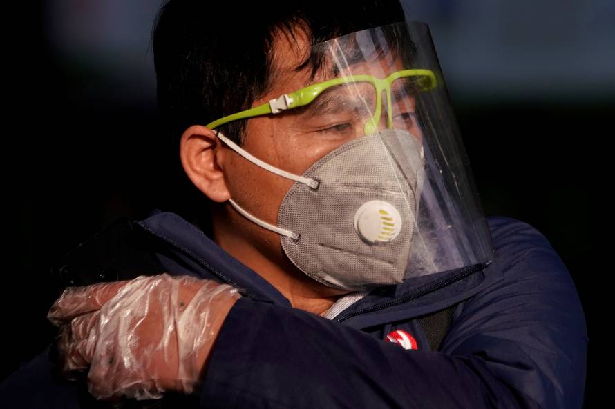 A man wearing a mask is seen at the Shanghai railway station in Shanghai