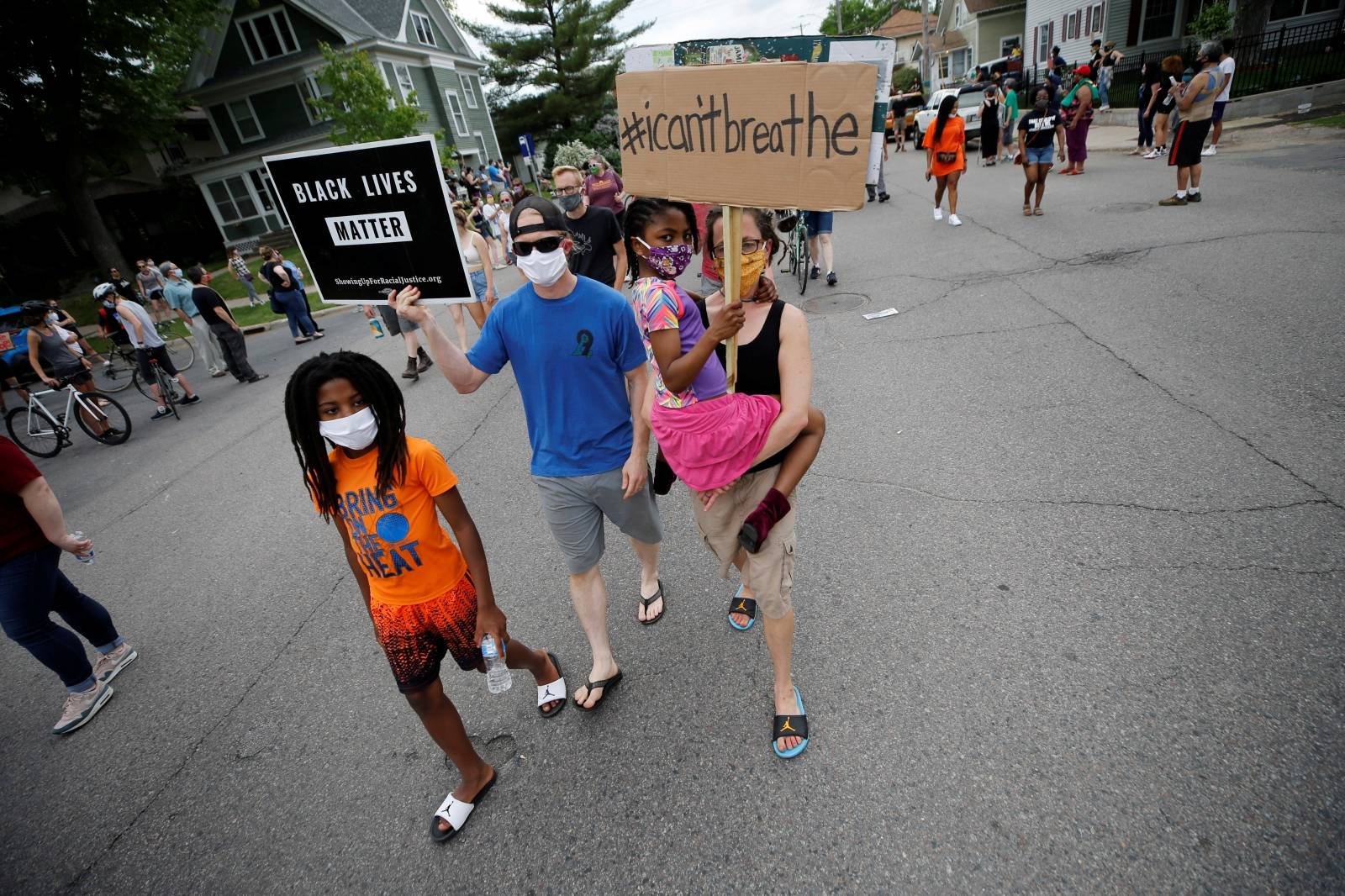 Protesters gather at the scene where Floyd was pinned down by a police officer in Minneapolis