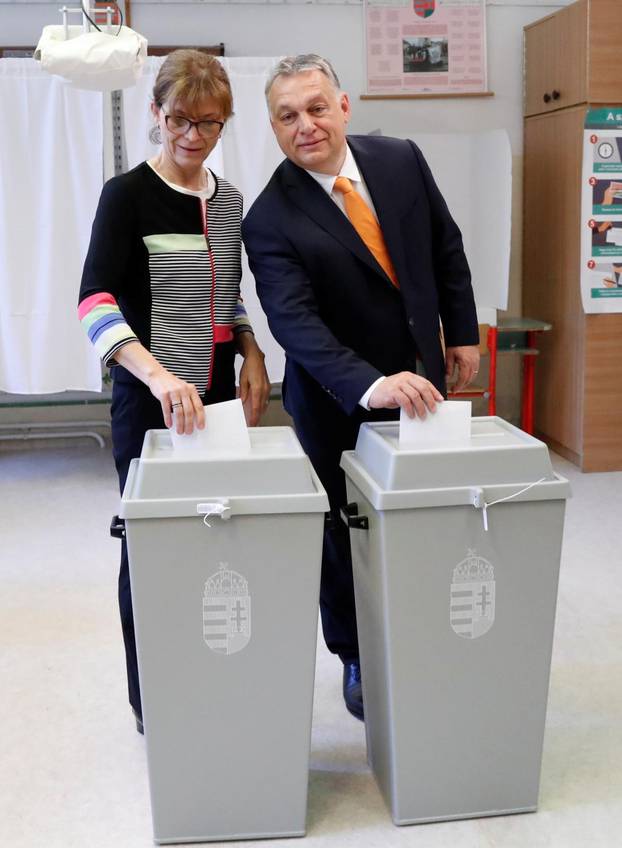 Hungarian Prime Minister Viktor Orban and his wife Aniko Levai cast their ballots during the European Parliament Elections in Budapest