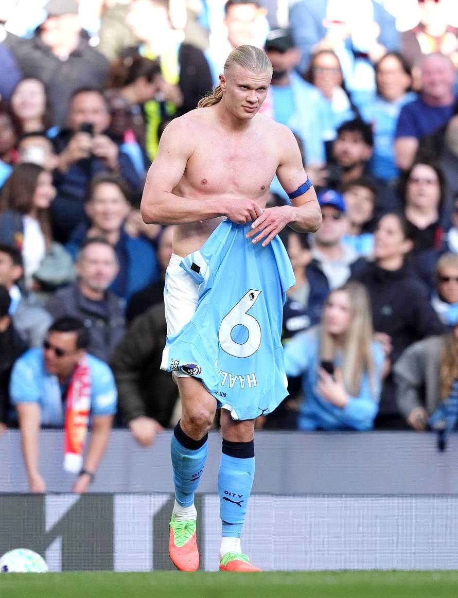 Manchester City's Erling Haaland replaces his shirt during the Premier League match at the Etihad Stadium, Manchester. Picture date: Sunday April 19, 2026.