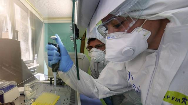 A medical technician works in the laboratory of the Infectious diseases department for coronavirus (COVID-19)