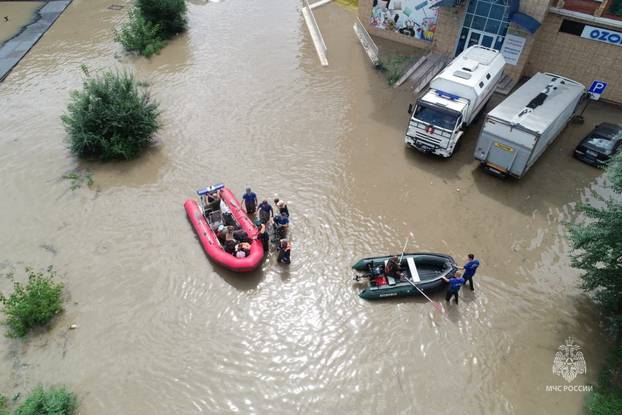 Rescuers use inflatable boats to evacuate residents of the flooded area in Ussuriysk