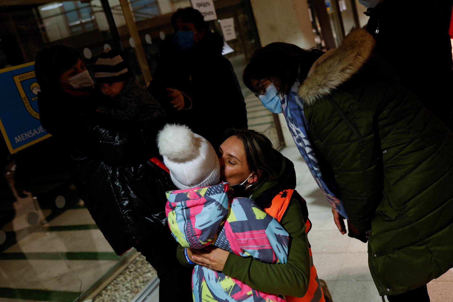 Marta Rodriguez, a taxi driver, bids farewell to Elina, 4, after finishing their trip from Poland to Madrid