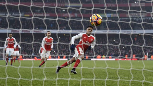 Arsenal's Alexis Sanchez scores their second goal from the penalty spot