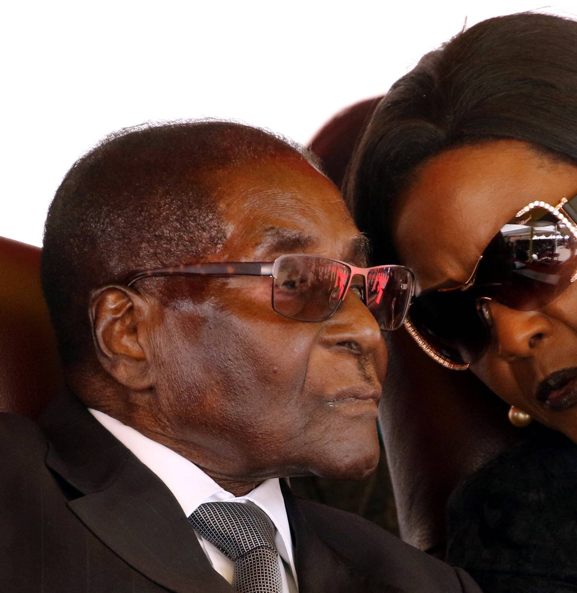 Mugabe and his wife Grace attend the burial of two independence luminaries in Harare