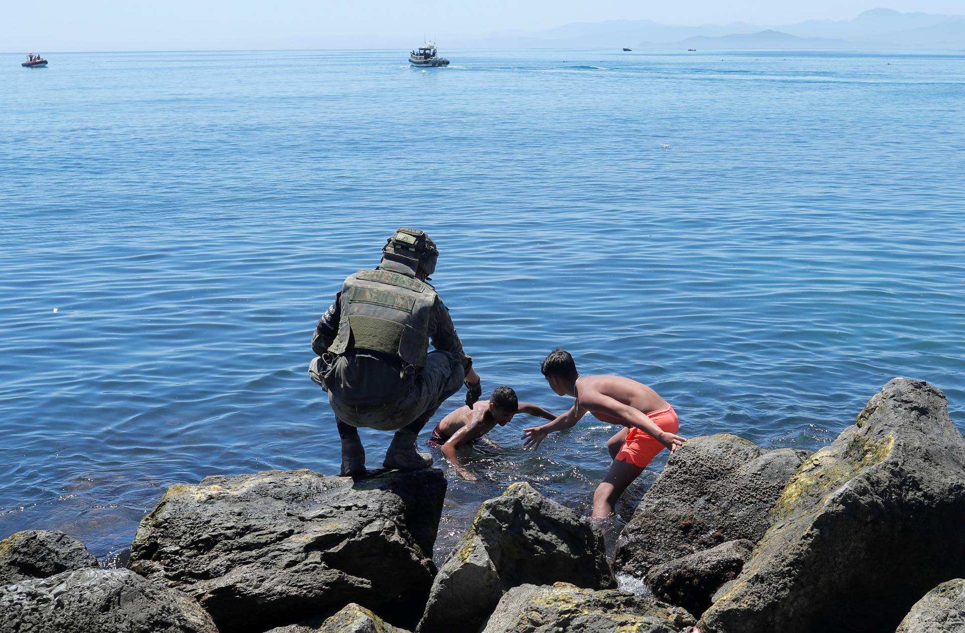 Thousands of migrants cross the Spanish-Moroccan border