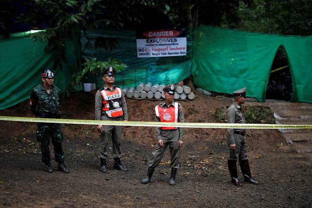 Police stand guard outside the Tham Luang cave complex after Thailand