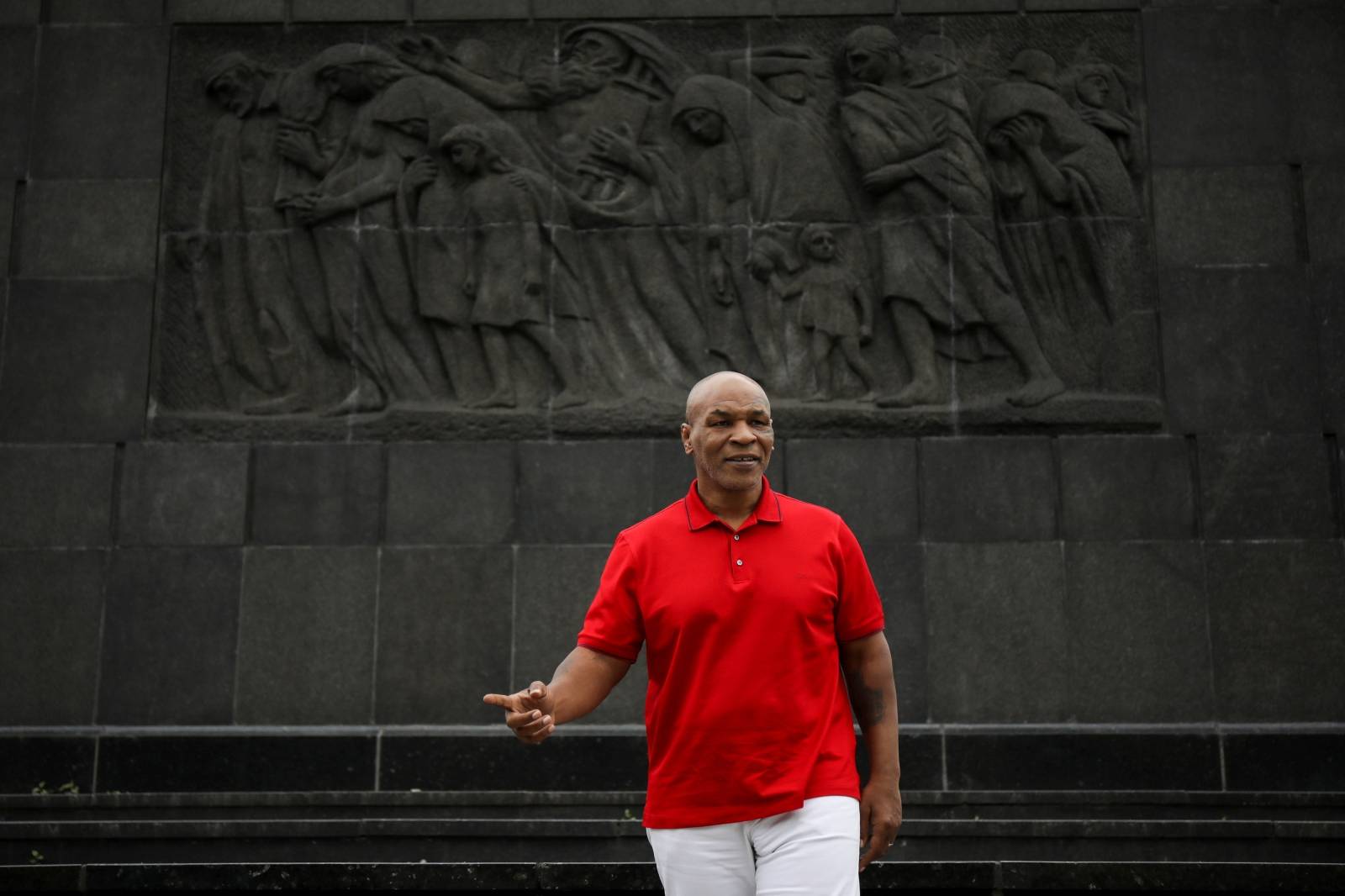 Former boxer Mike Tyson stands in front of the Warsaw's Ghetto Heroes Monument at the Museum of the History of Polish Jews in Warsaw