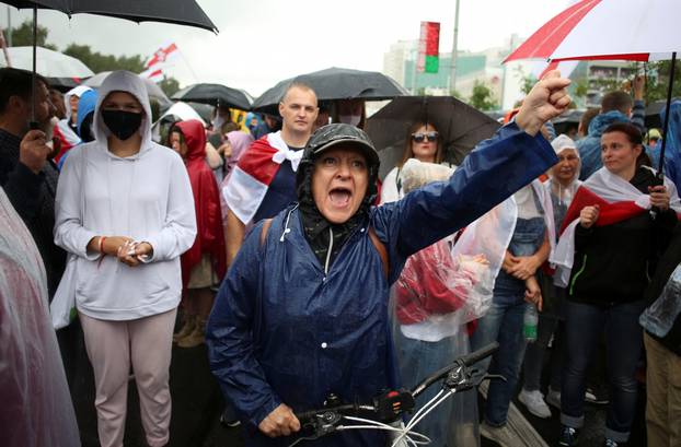 People attend an opposition rally to reject the presidential election results in Minsk