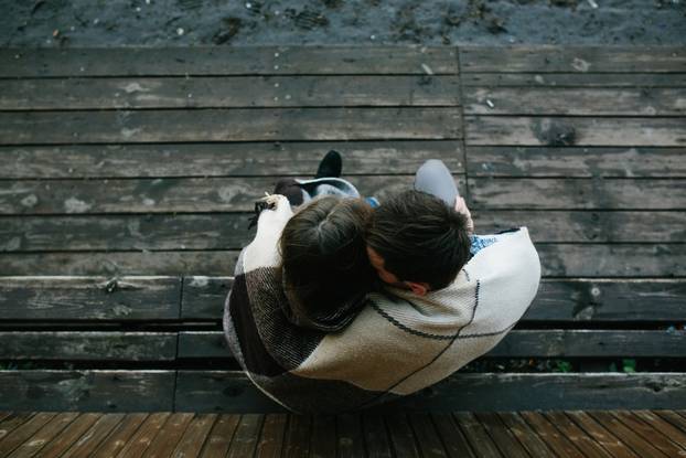 Young couple wrapped in plaid 