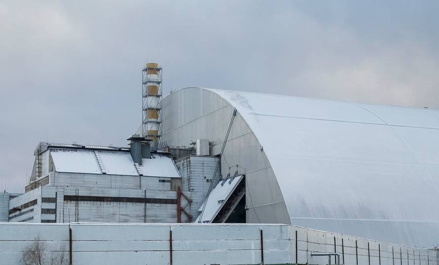 A general view shows a New Safe Confinement structure over the old sarcophagus covering the damaged fourth reactor at the Chernobyl nuclear power plant, in Chernobyl