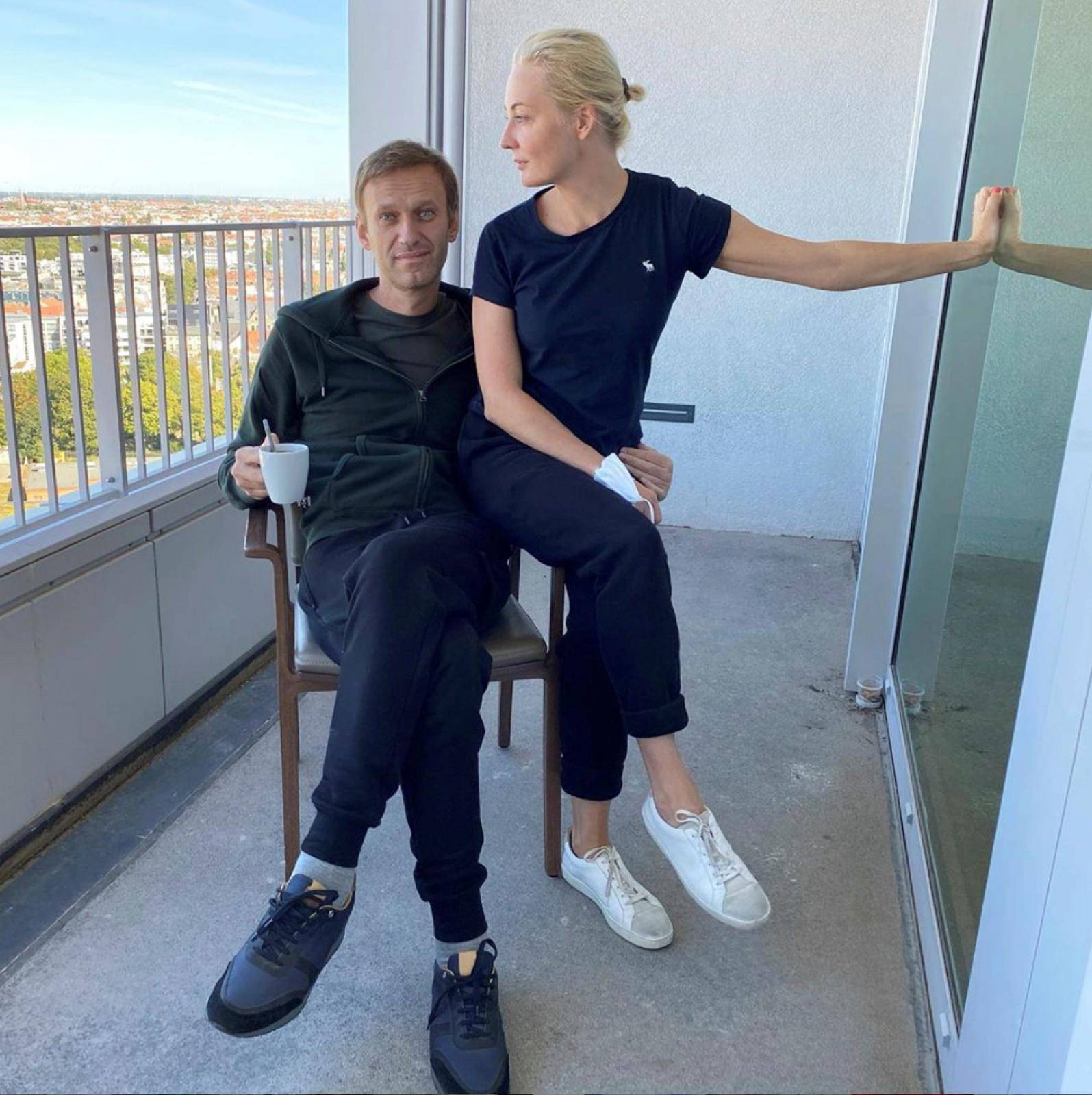 Russian opposition politician Navalny and his wife Navalnaya pose for a picture at Charite hospital in Berlin