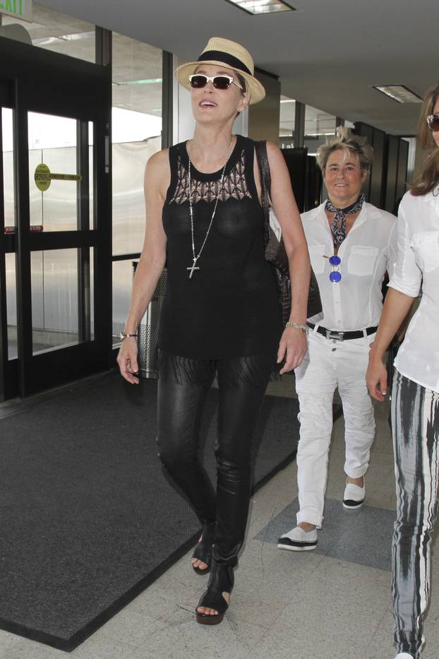 Actress Sharon Stone Suffers A Wardrobe Malfunction At LAX Airport