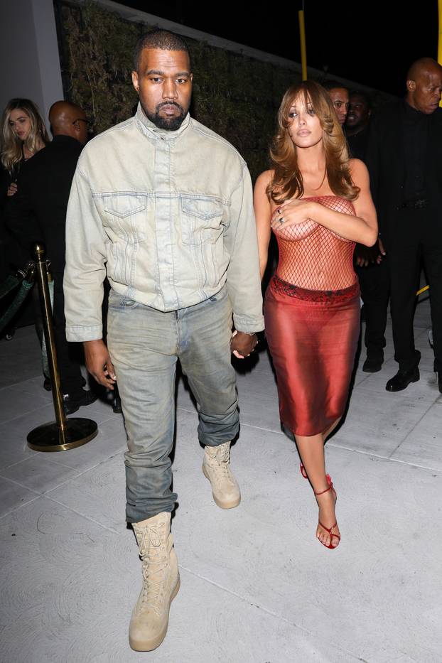 *PREMIUM-EXCLUSIVE* Bianca Censori Rocks Red Fishnet Top Leaving Living Room Club with Kanye West in LA