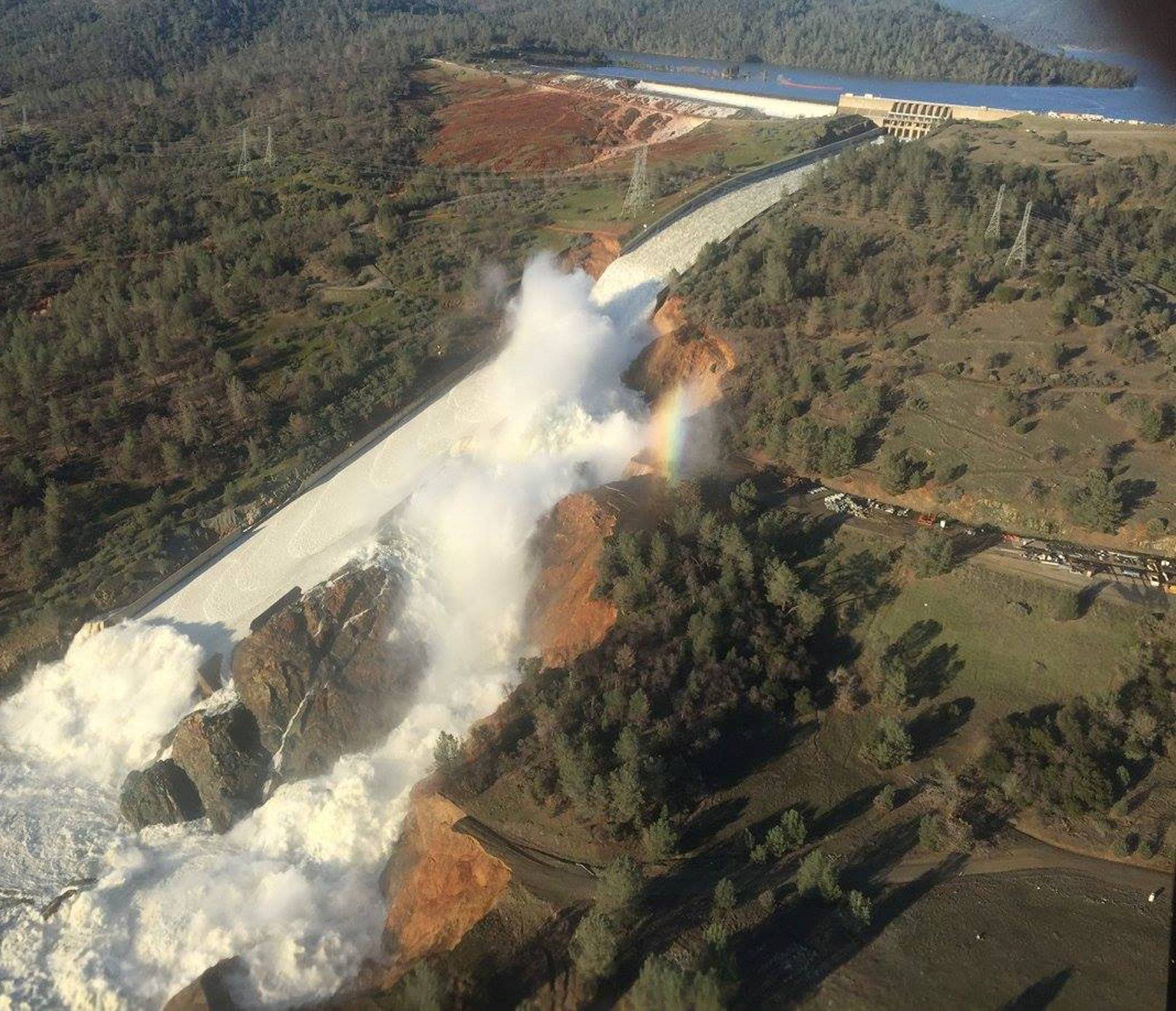 A damaged spillway with eroded hillside is seen in an aerial photo taken over the Oroville Dam in Oroville