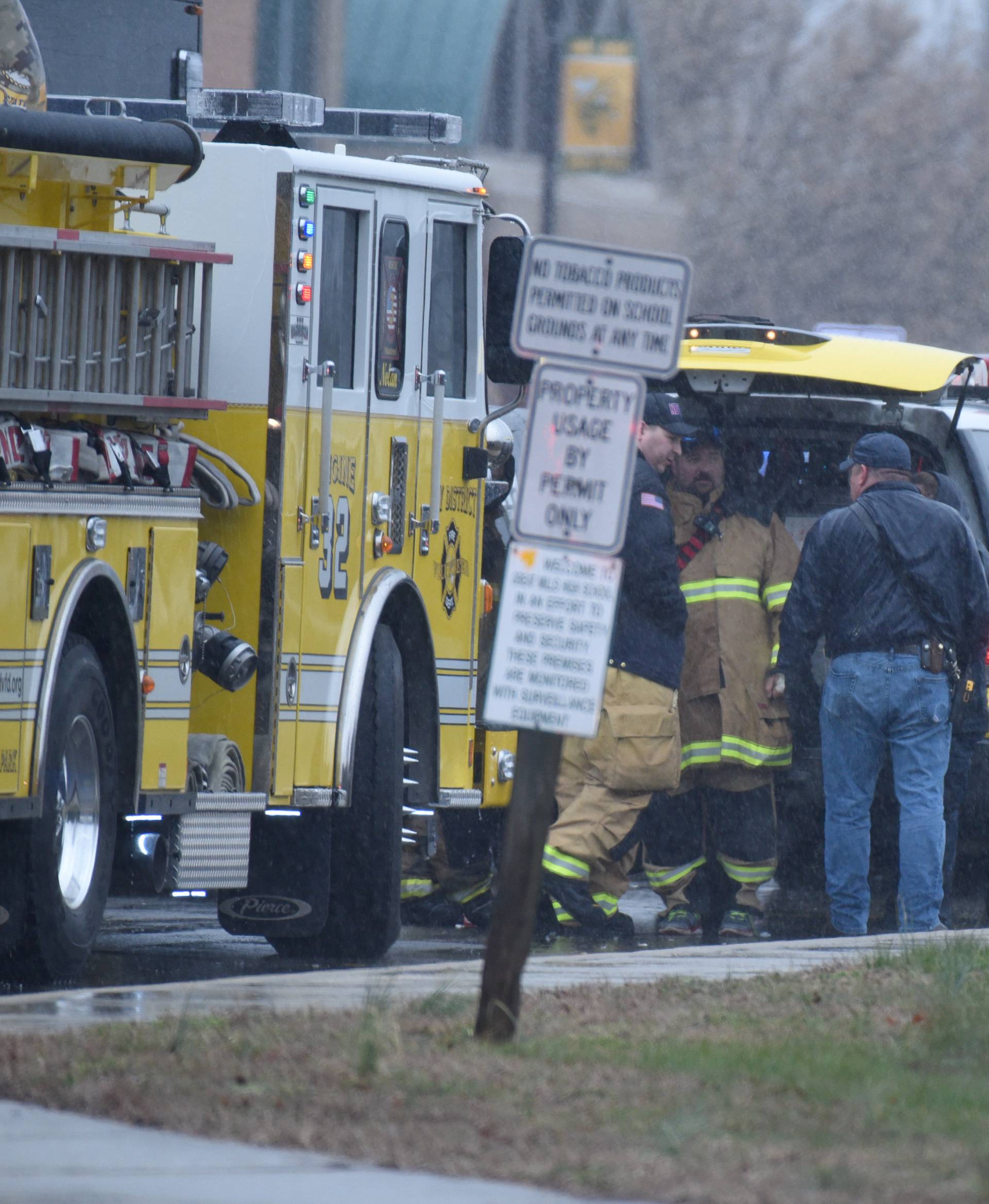 Emergency personnel and law enforcement officers stand outside Great Mills High School following a shooting on Tuesday morning in St. Mary's County, Maryland