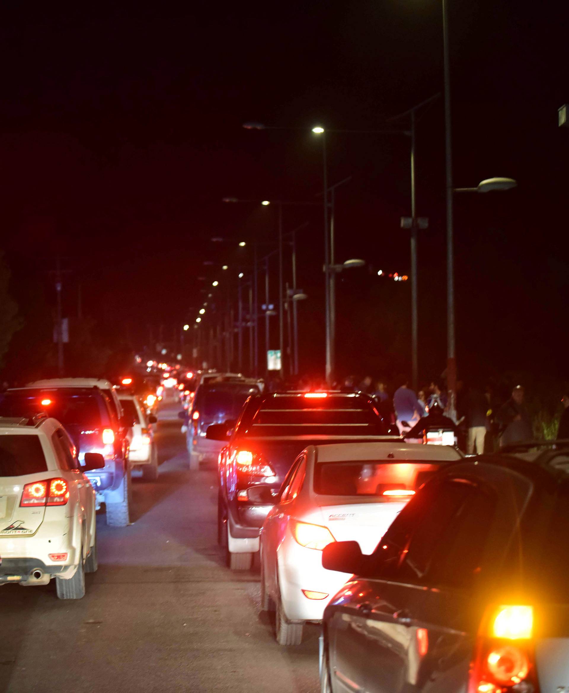 Cars evacuate away from the coast after an earthquake in Coquimbo