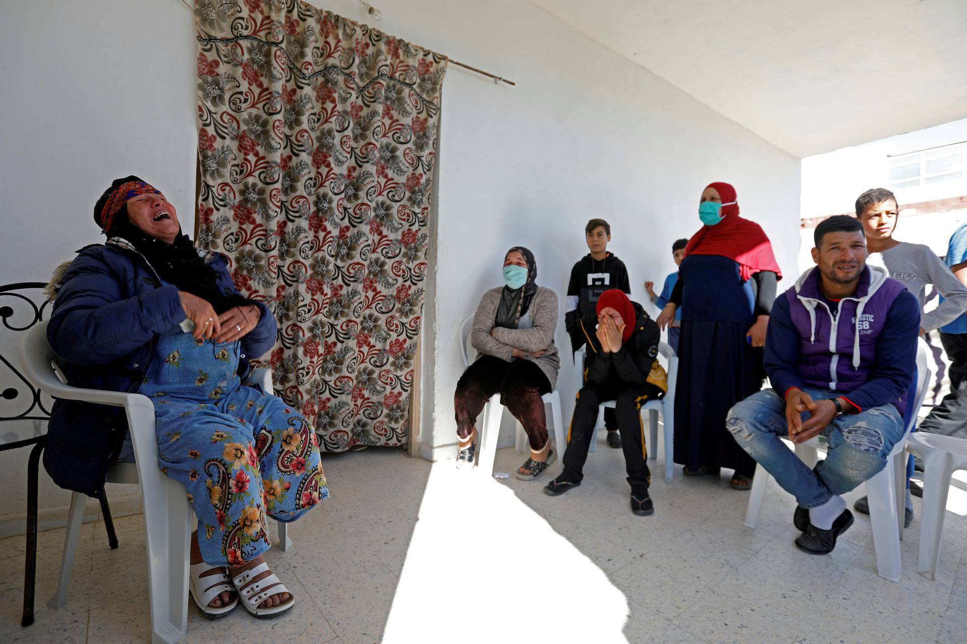 Gamra, the mother of Brahim Aouissaoui, who is suspected of carrying out Thursday's attack in Nice, France, reacts at her home in Thina, a suburb of Sfax, Tunisia