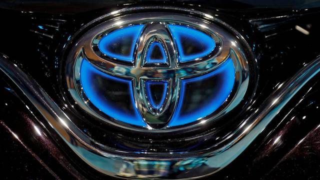 FILE PHOTO: FILE PHOTO: The Toyota logo is seen on the bonnet of a newly launched Camry Hybrid electric vehicle at a hotel in New Delhi