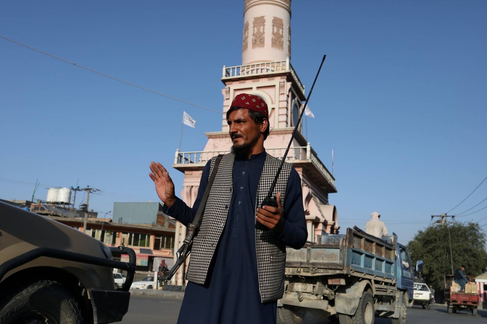 A Taliban soldier stand on a street in Kabul