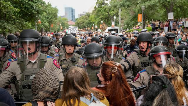 Texas state troopers in riot gear try to break up a pro-Palestinian protest at the University of Texas