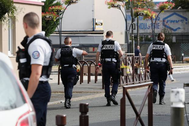 Police secure the area during an operation after components that can be used to make explosives were found in a flat in Villejuif