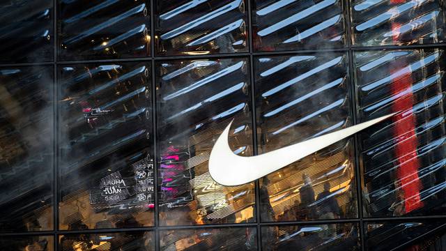 People visit the Nike store at 5th Avenue during the holiday season in New York