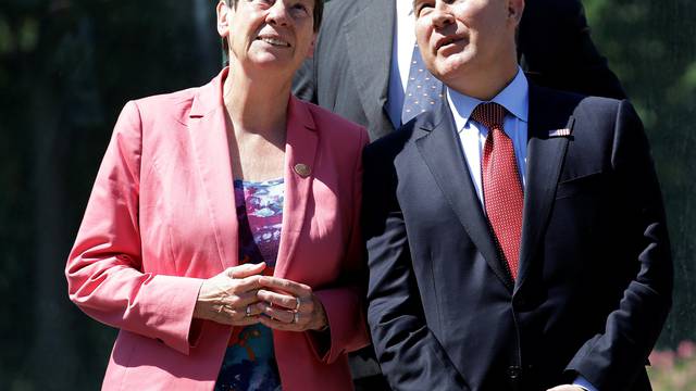 Environmental Protection Agency (EPA) Administrator Scott Pruitt looks on next to German Environment Minister Barbara Hendricks during a summit of  Environment ministers from the G7 group of industrialised nations in Bologna