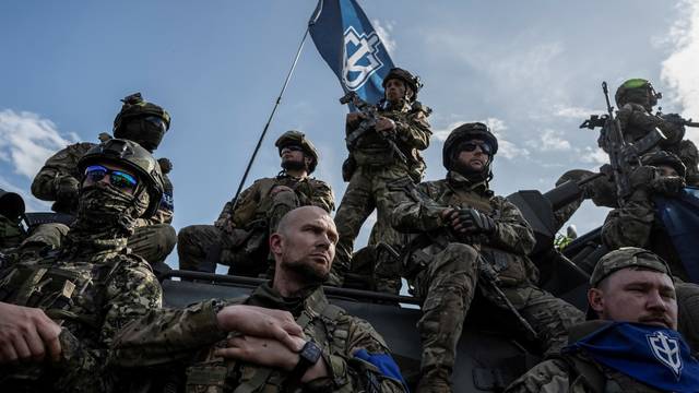 Members of the Russian Volunteer Corps are seen near Russian border, in Ukraine