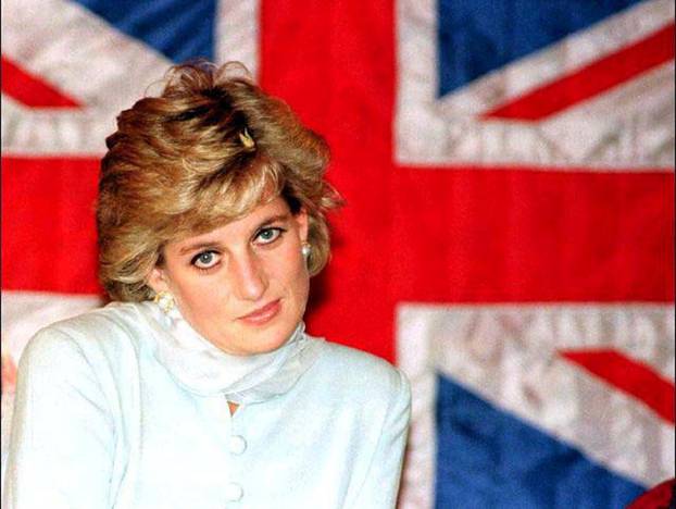 FILE PHOTO: FILE PHOTO OF THE PRINCES OF WALES SITTING IN FRONT OF A BRITISH FLAG