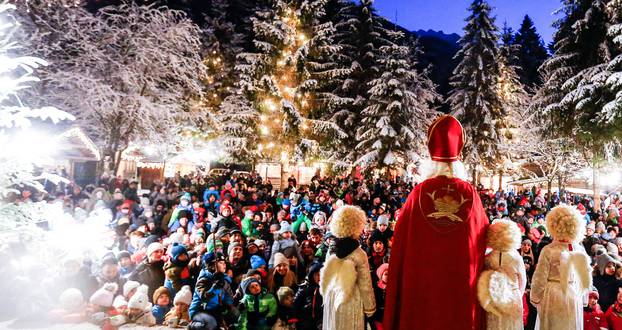 A man dressed as Santa Claus arrives at a Christmas market in Mayrhofen